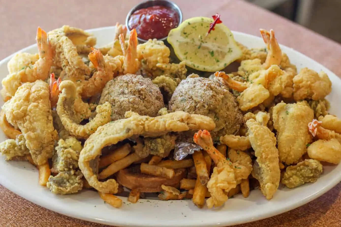 Fried seafood platter with shrimp, fish and fries