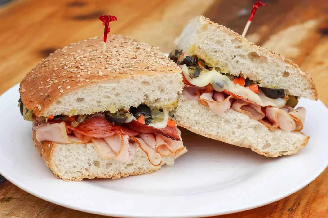 Muffaletta cut in half to show the olive salad