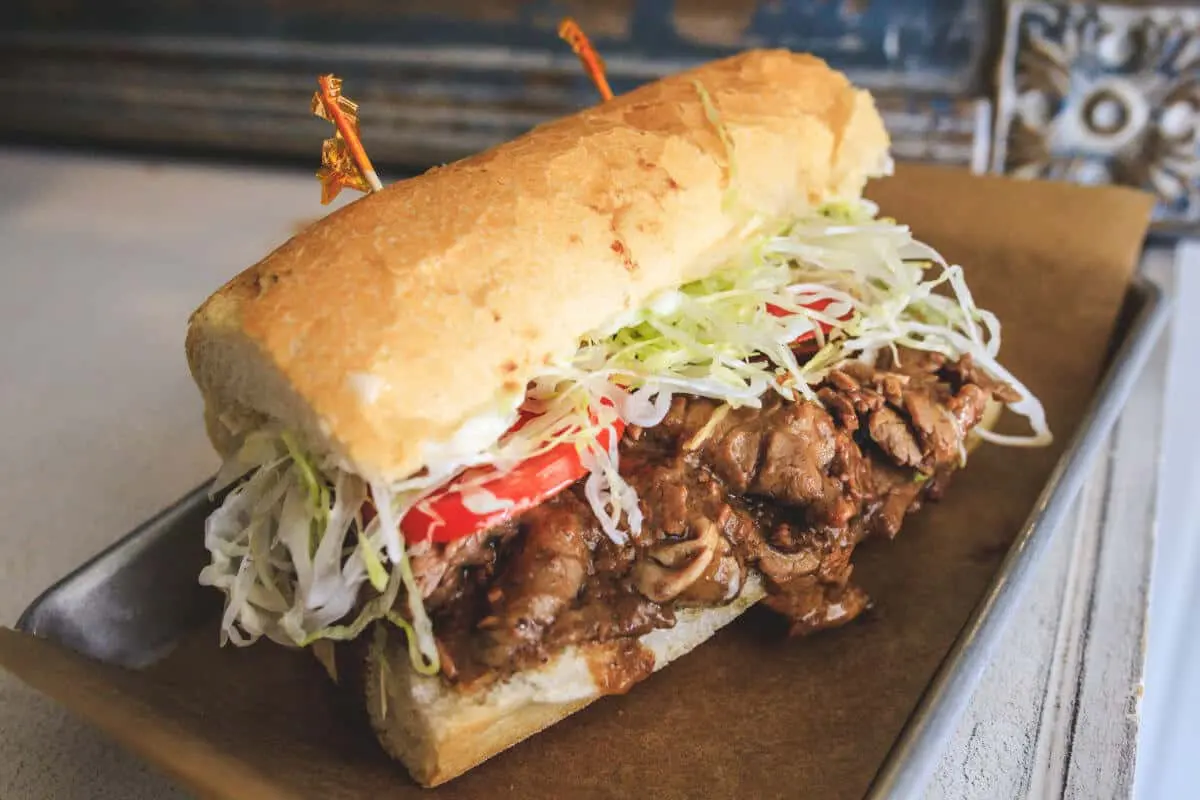 Poboy dressed with shredded lettuce and tomato